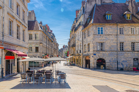 Besancon cityscape old town center ville, BesanÃ§on city historic center, street restaurant cafe on Grande Rue street with old medieval buildings in sunny day, Bourgogne-Franche-Comte region, Franceの写真素材