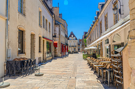 Rue Vauban pedestrian street in Dijon city historic center with street restaurant and old typical houses medieval buildings, Dijon old town in sunny summer day, Bourgogne-Franche-Comte region, Franceの写真素材