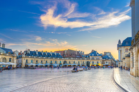Place de la Liberation square in Dijon city historical center with old buildings, street restaurants and cafes, Dijon old town evening view on twilight dusk, Bourgogne-Franche-Comte region, Franceの写真素材