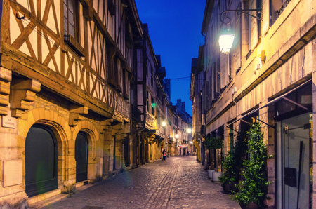 Old medieval houses buildings on Rue Verrerie pedestrian street in Dijon city historical center, Dijon old town center ville on twilight dusk evening view, Bourgogne-Franche-Comte region, Franceの写真素材