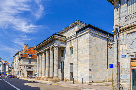 The ThÃ©Ã¢tre Ledoux city theater building with columns in Besancon old town center ville, La boucle de BesanÃ§on city historic center in sunny summer day, Bourgogne-Franche-Comte region, Franceの写真素材