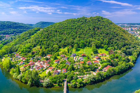 Aerial view of Chaudanne Mount Chaudanne Hill with green forest, residential houses of Mazagran district BesanÃ§on city, Doubs river and green hills background, Bourgogne-Franche-Comte region, Franceの写真素材