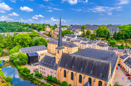Luxembourg City historical center aerial view with NeimÃ«nster Abbey or NeumÃ¼nster Abbey, Saint John's on the Stone catholic Church in river Alzette valley, Rham Plateau buildings in Grund districtの写真素材