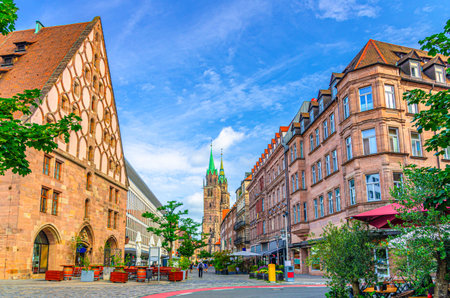 Old town Nuremberg city historical center, pedestrian street KÃ¶nigstraÃe King Street with old medieval buildings, Mauthalle Former Customs House and Saint Lawrence church towers background, Germanyの写真素材