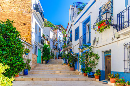 Alicante old town Santa Cruz with Calle San Rafael narrow street steep stairs, typical white houses...