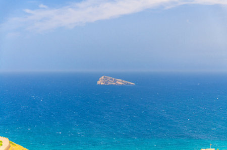 Isla de Benidorm Island rock in Benidorm bay Mediterranean Sea azure water of Costa Blanca in summer day, Valencian Community, Spainの写真素材