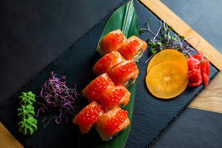 Fresh Salmon Sushi Rolls on Slate Boardの写真素材