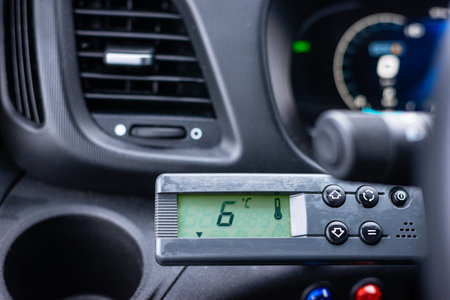 Close up of a climate control device displaying temperature settings inside a professional vehicle...