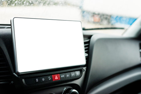 Perspective view of a car interior with a prominent blank tablet screen mounted on the dashboard for...