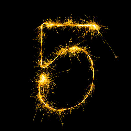 Shining number five created with light painting technique for celebration milestones or holiday...