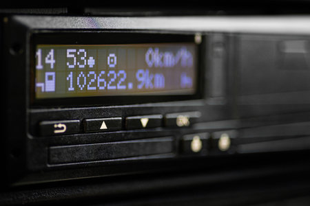 Close up of professional digital tachograph screen in commercial vehicle dashboard used for...