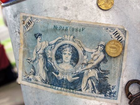 Banknote with coins that are sold by numismatists in the market of Belarus.