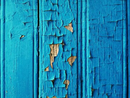 Old texture of wooden boards, with peeling blue paint. Abstract wallpaper. Retro surface with place for text.の写真素材