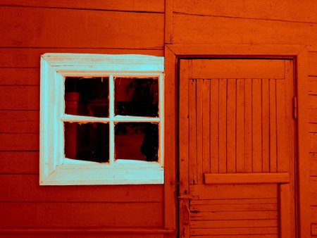 Doors and white window of a wooden house. Part of the house, outside view.の写真素材