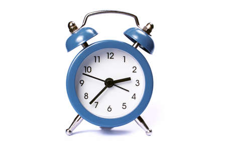 Alarm clock isolated on a white background. Business concept. Photo of a clock for designの写真素材