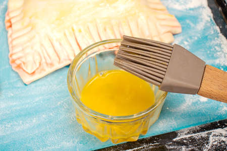 Culinary brush and yolk for brushing croissants. Food conceptの写真素材