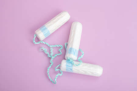 Sanitary tampon isolated on pink background. Beauty and hygiene conceptの写真素材