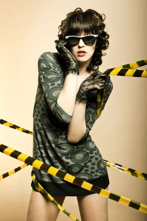Fashion art portrait of a beautiful young sexy woman wearing sunglassesの写真素材