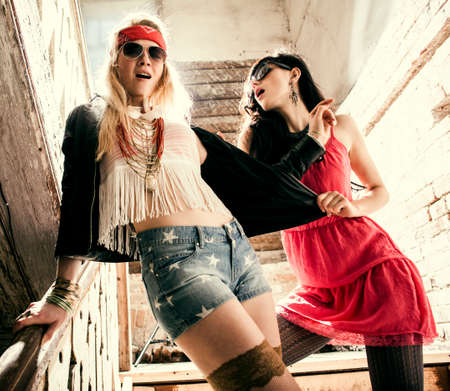 Fashion portrait of a beautiful young womans wearing sunglassesの写真素材