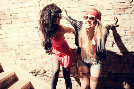Fashion portrait of a beautiful young womans wearing sunglassesの写真素材