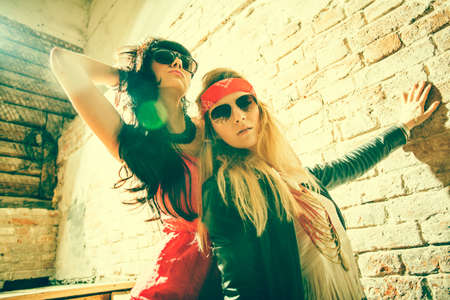 Fashion portrait of a beautiful young womans wearing sunglasses の写真素材