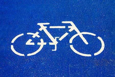 Bicycle sign on the colored asphalt bike pathの写真素材