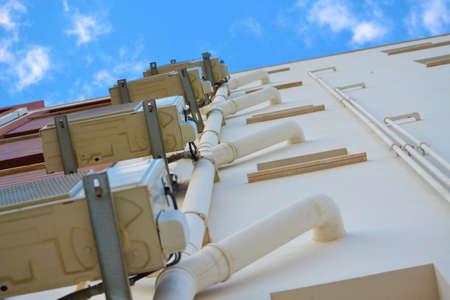 Air conditioning systems with duct on the wall of buildingの写真素材