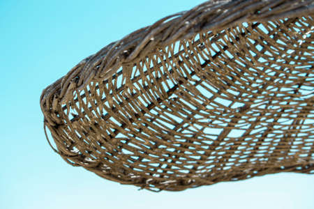 Straw umbrella on the sand beach near the seaの写真素材