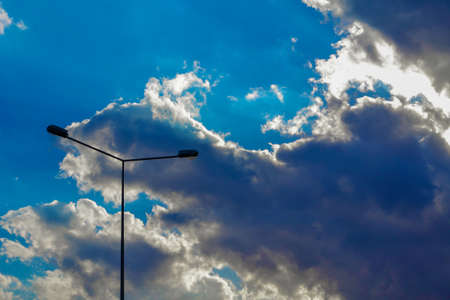 Street lapm on bright blue cloudy sky backgroundの写真素材