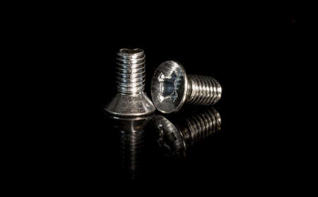 screws macro photo, screw background, metal screw, steel screw, screw macro, repair screwの写真素材