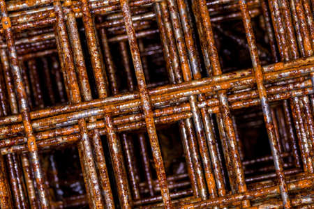 Rusty Wire Mesh Macro Closeup against White Cement Floor as Metal Grid Net Seamless Abstract...