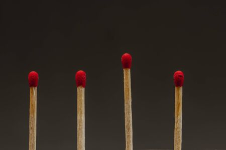 Group of matchsticks representing a team with a bad or great leader, fatigues employeesの写真素材