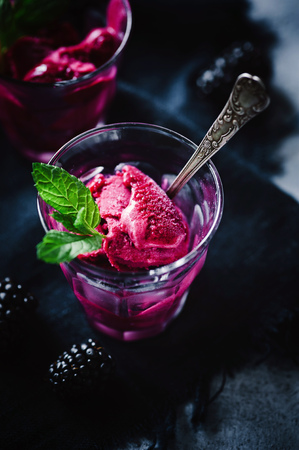 Blackberry sorbet on dark backgroundの写真素材