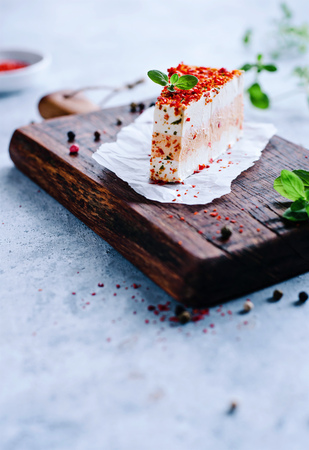 Fresh cheese with chilli on rustic woodの写真素材