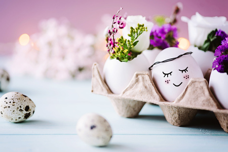 Sweet Easter card - Small easter egg with face lies in the egg carton
