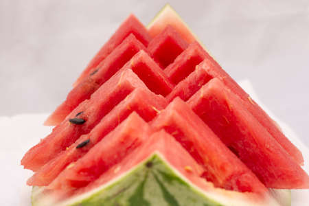 closeup to ripe fresh watermelon with seeds, closeup to watermelon slicesの写真素材