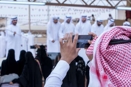 Saudi Man snaps Men perform a Yawalah traditional dance in Janadriyah Festival Essay February 23, 2018 in Riyadh, Saudi Arabiaのeditorial素材