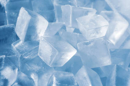 Ice cubes on soft blue background. coldの写真素材