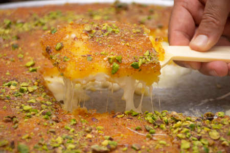 Arabic sweet "Konafa" or "Knafeh" with white cheese and pistachioの写真素材