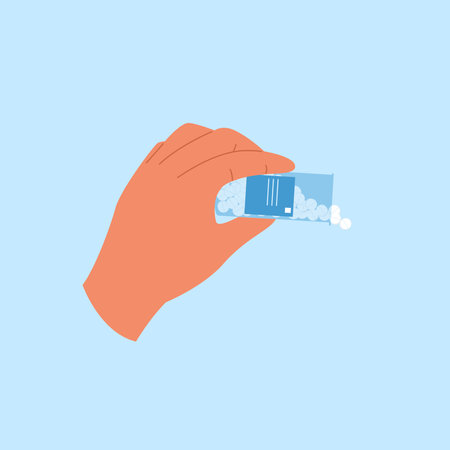 Hand holds bottle with pills spilling out. Open container with antibiotic tablets &#xA;のイラスト素材