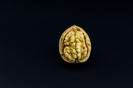 close-up walnuts on black backgroundの写真素材