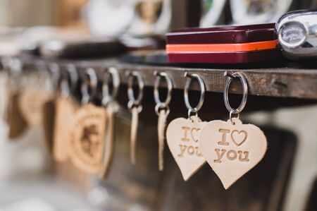 Keychains with a sign I love you hanging on the boardの写真素材