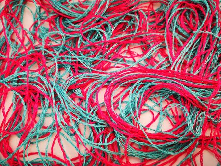 Beautiful bright background of juicy pink and blue threadsの写真素材