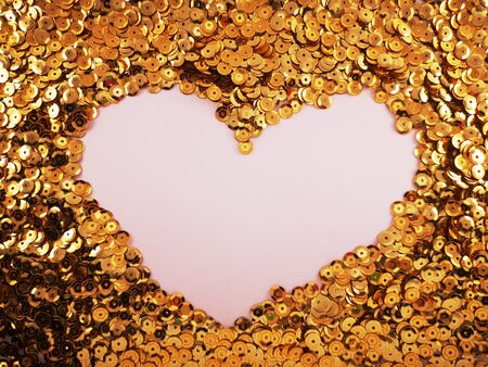 White heart on a background of gold rhinestones for postcards to valentine's dayの写真素材