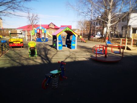 Empty colorful playground in the yard in the park, sports complexの写真素材