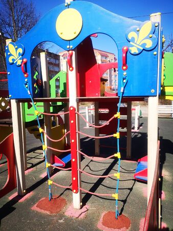 Empty colorful playground in the yard in the park, sports complexの写真素材