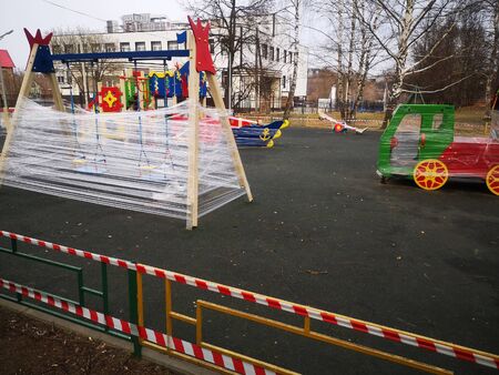 An empty colorful playground in a park is sealed.の写真素材