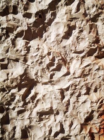 Grey stone wall. A rocky background. Abstract structure.の写真素材
