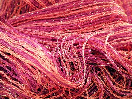 Beautiful bright background of juicy pink and gold threadsの写真素材