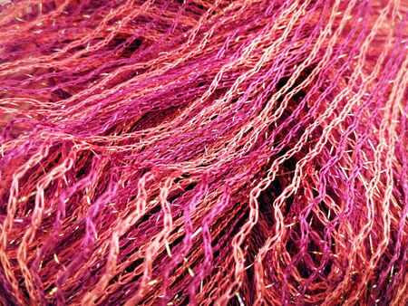 Beautiful bright background of juicy pink and gold threadsの写真素材